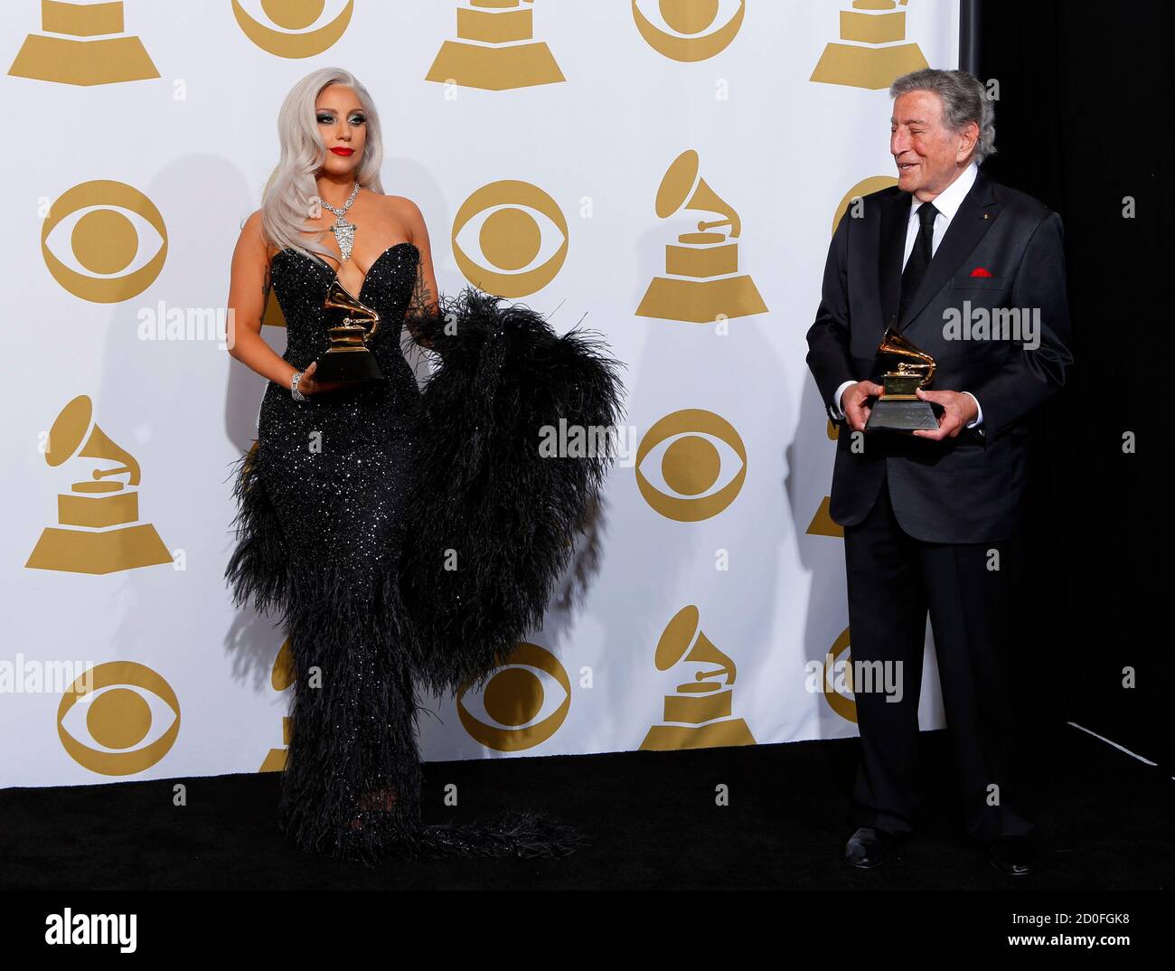 Lady Gaga and Tony Bennett pose in the press room with the awards they won  for Best Traditional Pop Vocal Album for "Cheek To Cheek" during the 57th  annual Grammy Awards in