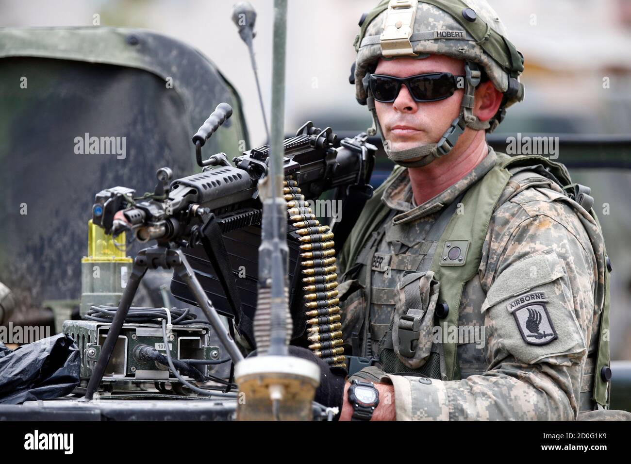 A NATO soldier takes part in a battle conducted exercise called ' Saber Junction Exercise' at the military ground in Hohenfels near Regensburg September 8, 2014. Saber Junction 14 is a U.S. Army Europe led, U.S. European Command directed, multinational, multiservice exercise that involves more than 5,800 personnel from 17 countries in several locations in Europe.   REUTERS/Michael Dalder (GERMANY - Tags: MILITARY) Stock Photo