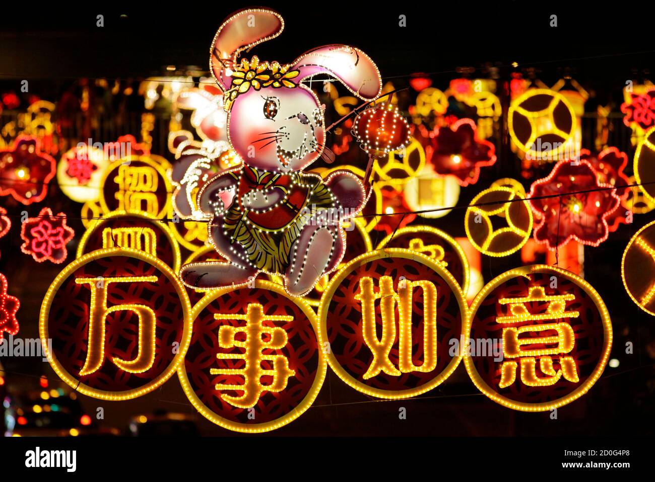 chinese-new-year-decorations-hang-above-a-street-in-singapore-january-21-2011-the-chinese-characters-read-may-all-your-wishes-come-true-the-lunar-new-year-begins-on-february-3-and-marks-the-start-of-the-year-of-the-rabbit-according-to-the-chinese-zodiac-reuterstim-chong-singapore-tags-society-2D0G4P8.jpg
