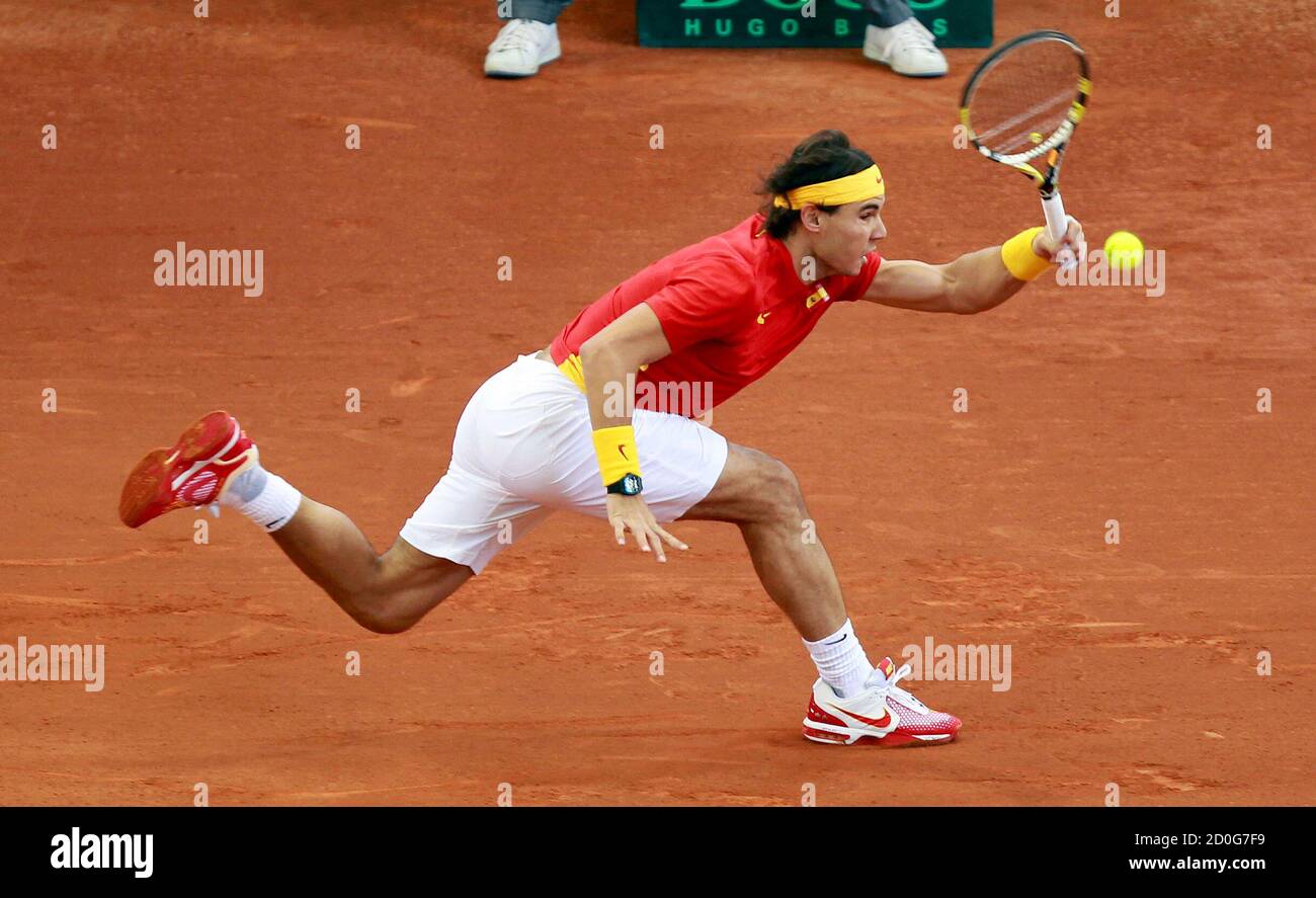 Spain's Rafael Nadal returns the ball to Argentina's Juan Martin Del Potro  during their Davis Cup final reverse singles rubber at the Olympic Stadium  in Seville December 4, 2011. REUTERS/Javier Diaz (SPAIN -