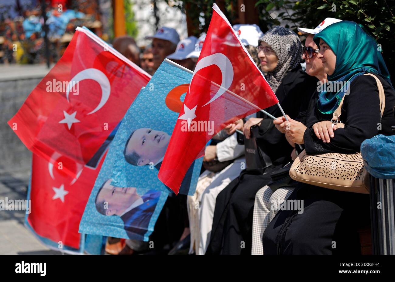 Supporters attend a gathering in support of Turkey's Prime Minister and presidential candidate Tayyip Erdogan in Istanbul August 8, 2014. Erdogan is set to secure his place in history as Turkey's first popularly-elected president on Sunday, but his tightening grip on power has polarised the nation, worried Western allies and raised fears of creeping authoritarianism. REUTERS/Murad Sezer (TURKEY  - Tags: POLITICS ELECTIONS) Stock Photo