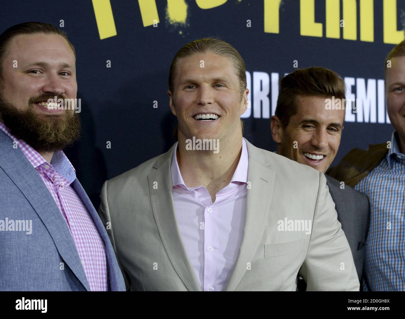 Cast member and Green Bay Packers football linebacker Clay Matthews (C)  poses with fellow teammates at the premiere of "Pitch Perfect 2" in Los  Angeles, California, United States May 8, 2015. The