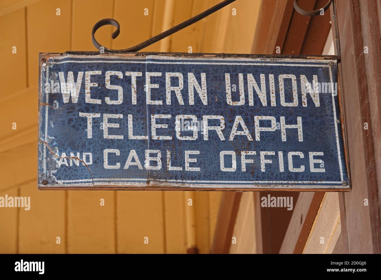 Santa Susana, CA / USA - July 15, 2020: A Western Union Telegraph and Cable Office vintage sign hangs outside a preserved train station in California. Stock Photo