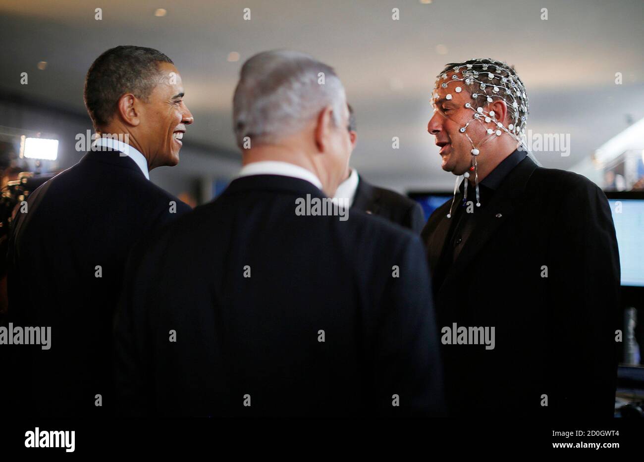 U.S. President Barack Obama (L) and Israeli Prime Minister Benjamin Netanyahu (C) speak with Professor Amir Geva (R), head of the biomedical signal processing and pattern recognition lab at the Ben-Gurion University of the Negev, as they tour a technology expo at the Israel Museum in Jerusalem March 21, 2013.   REUTERS/Jason Reed   (JERUSALEM - Tags: POLITICS TPX IMAGES OF THE DAY) Stock Photo
