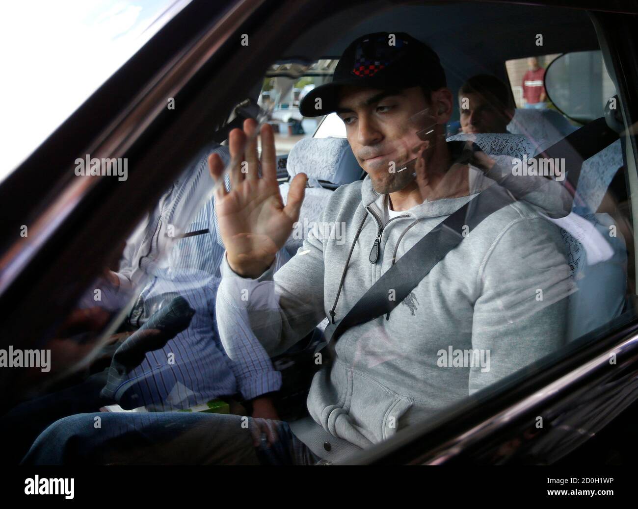 Lotus Formula One driver Pastor Maldonado of Venezuela gets on a taxi after visiting the hospital where Marussia Formula One driver Jules Bianchi of France is hospitalized, in Yokkaichi, Mie prefecture, October 6, 2014. Bianchi was fighting for his life on Sunday after suffering a severe head injury and undergoing surgery following a Japanese Grand Prix crash. Formula One's governing body said the 25-year-old lost control of his Marussia on the wet track, travelled across the runoff area and hit the rear of a recovery tractor which was trying to remove a stricken Sauber. REUTERS/Toru Hanai (JA Stock Photo
