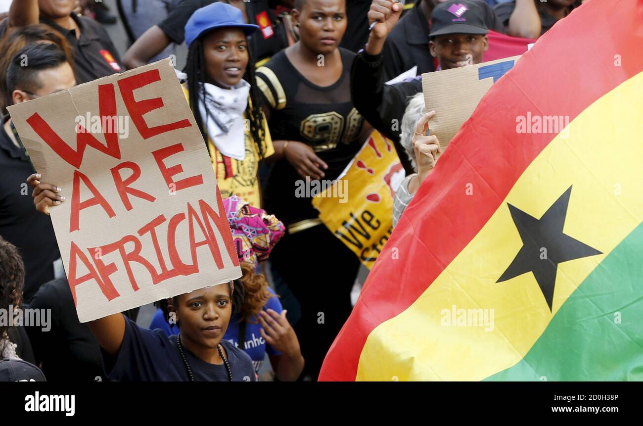 Demonstrators carry placards during a march against xenophobia in downtown Johannesburg, April 23, 2015. A wave of anti-immigrant violence has so far claimed seven lives in trouble spots in Durban and Johannesburg, to where the government announced the deployment of defence forces on Tuesday.  REUTERS/Mike Hutchings Stock Photo