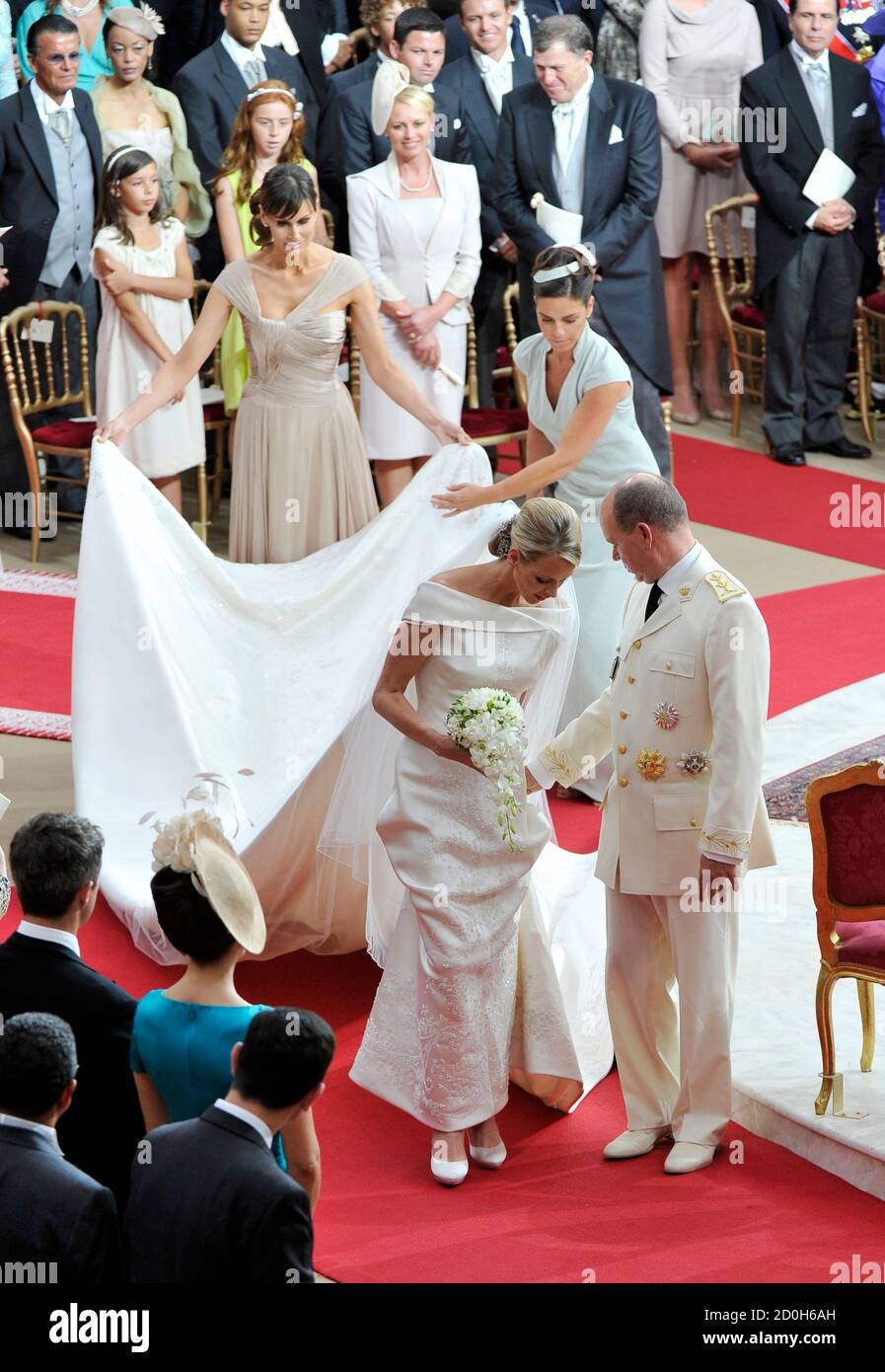 Danish Born Designer Isabell Kristensen Back L And Maid Of Honour Donatella Knecht De Massy Back R Hold The Wedding Dress Train As Prince Albert Ii Of Monaco R And Princess Charlene L