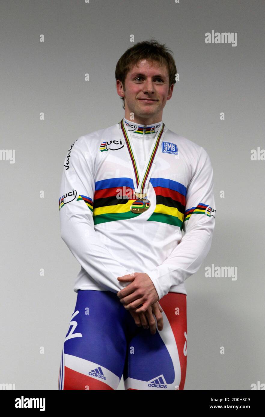 British Cyclist Jason Kenny Shows Of The World Individual Sprint Championship Jersey At The Olympic Velodrome In London February 16 2012 Kenny Was Promoted To World Individual Sprint Champion After Frenchman Gregory