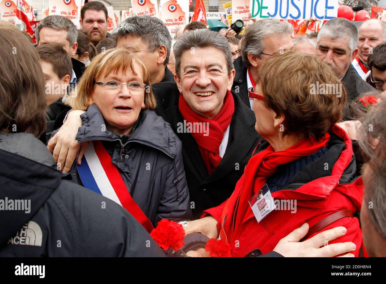 Jean-Luc Melenchon (C), leader of France's Parti de Gauche political party  and the Front de Gauche political party's candidate for the 2012 French  presidential election, French Communist deputy Marie-Georges Buffet (L) and
