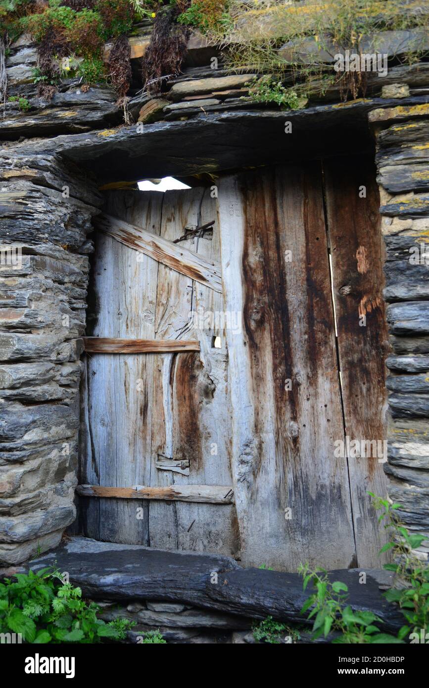 Typical old stone house and wooden door in Ushguli, Svaneti Stock Photo ...