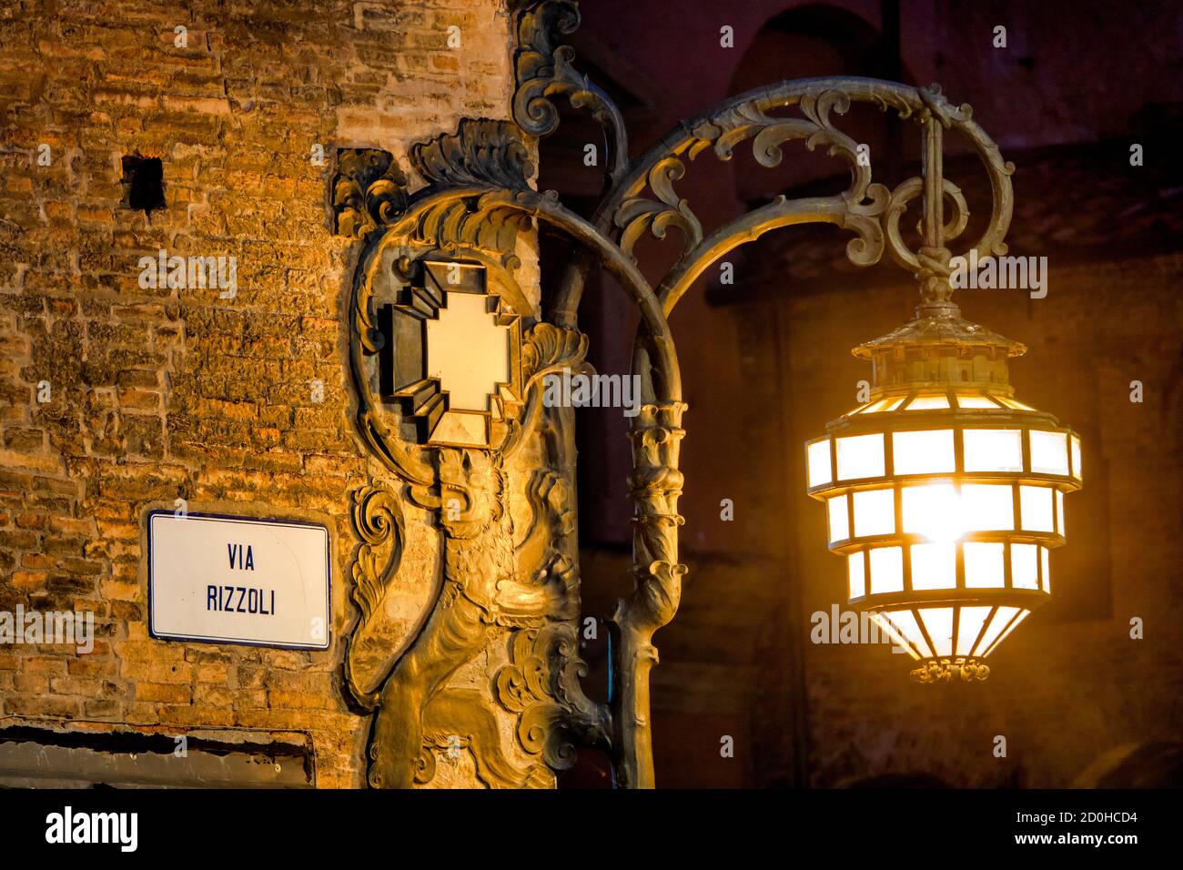 Illuminated street lamp on Palazzo Re Enzo, Bologna, Italy Stock Photo