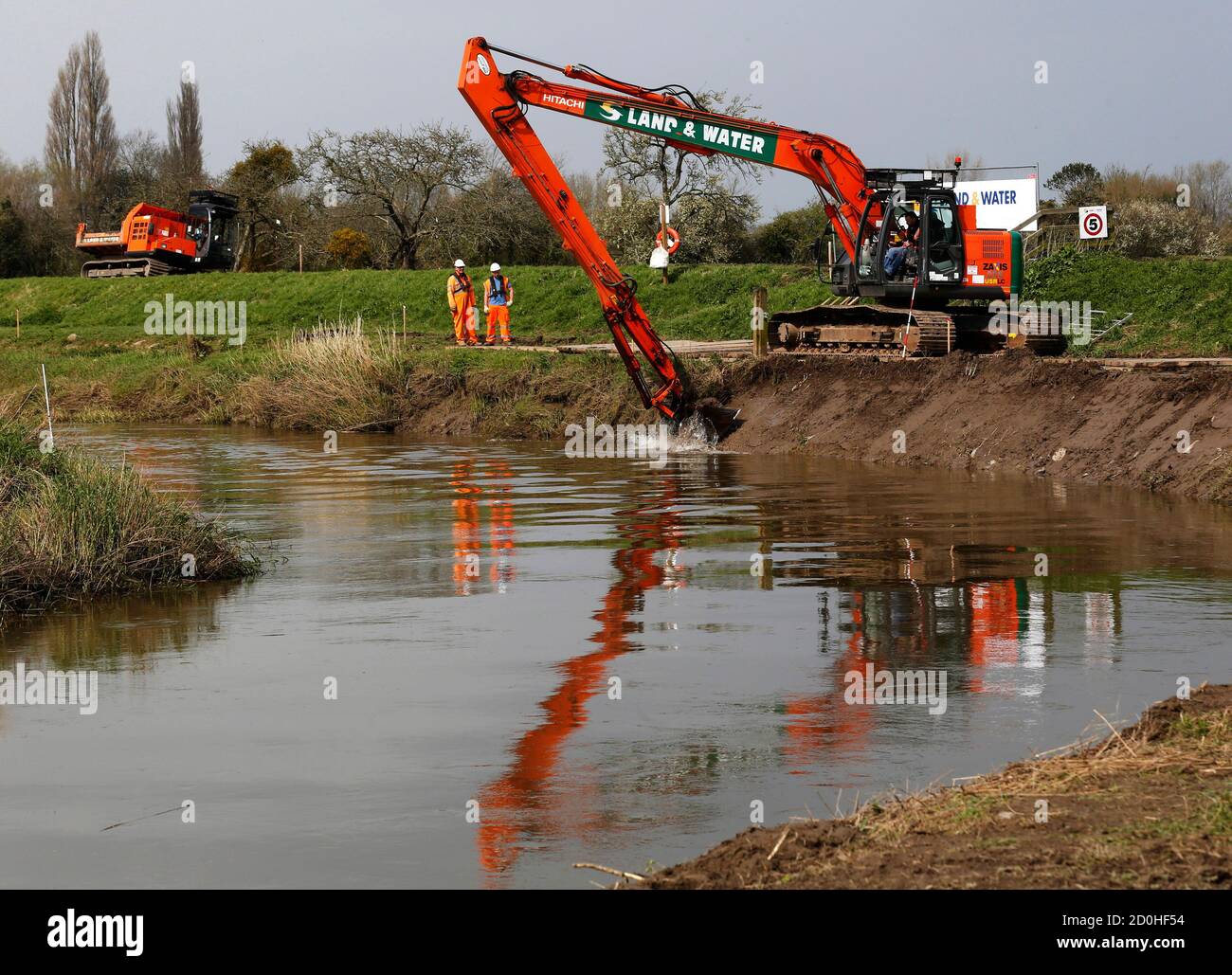 Workmen begin dredging work on the River Parrett at Burrowbridge, following severe flooding in the  Somerset Levels earlier in the year, in southwest England March 31, 2014.  REUTERS/Luke MacGregor  (BRITAIN - Tags: POLITICS ENVIRONMENT SOCIETY) Stock Photo