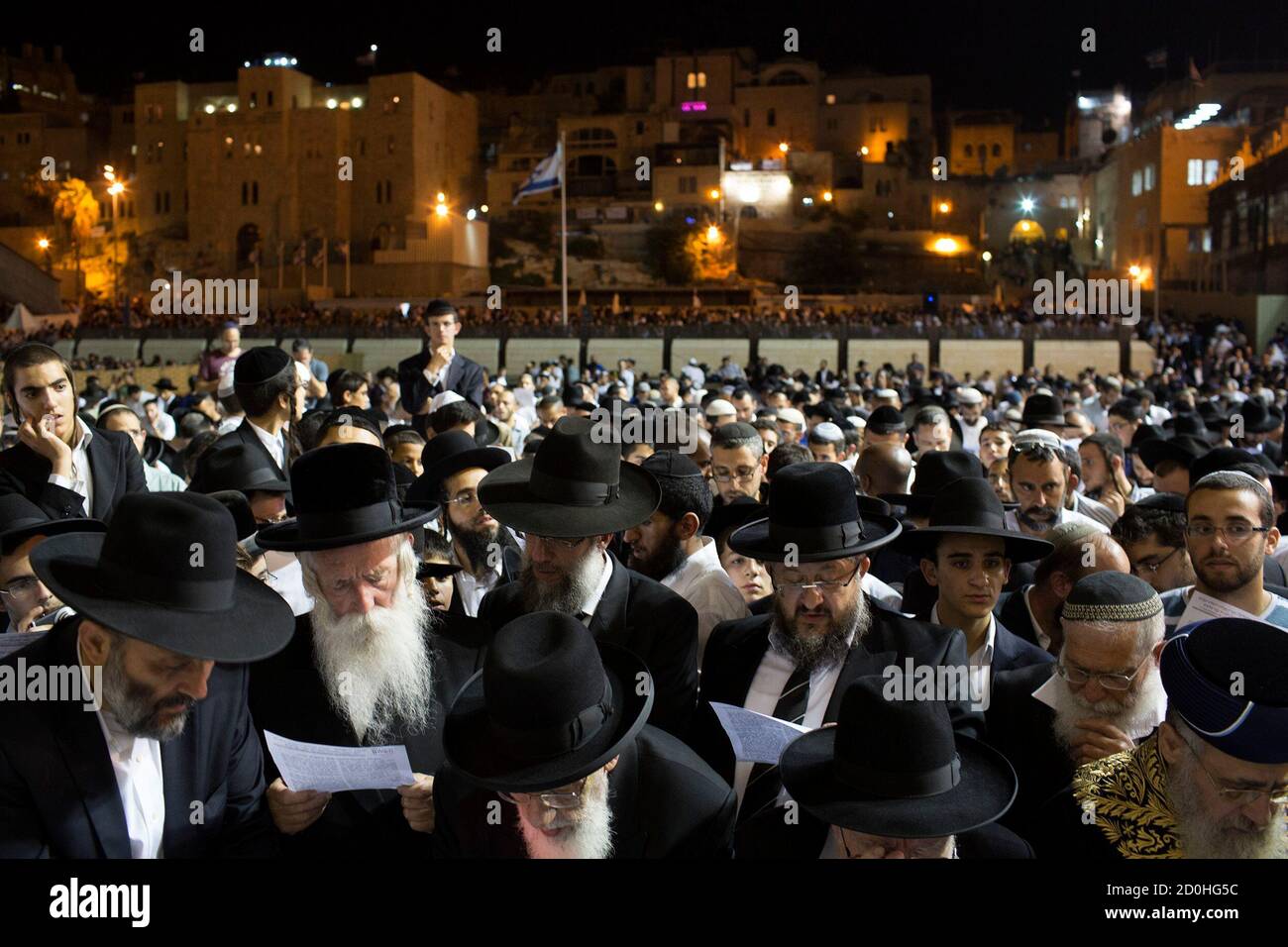 Jewish worshippers take part in a special prayer at the Western Wall in Jerusalem's Old City for the well-being of Israeli soldiers in Gaza July 23, 2014. Gaza fighting raged on Wednesday, displacing thousands more Palestinians in the battered territory as U.S. Secretary of State John Kerry said efforts to secure a truce between Israel and Hamas had made some progress. Israel announced that three of its soldiers were killed by explosive devices on Wednesday, lifting the army death toll to 32.  REUTERS/Siegfried Modola (JERUSALEM - Tags: RELIGION CIVIL UNREST CONFLICT) Stock Photo