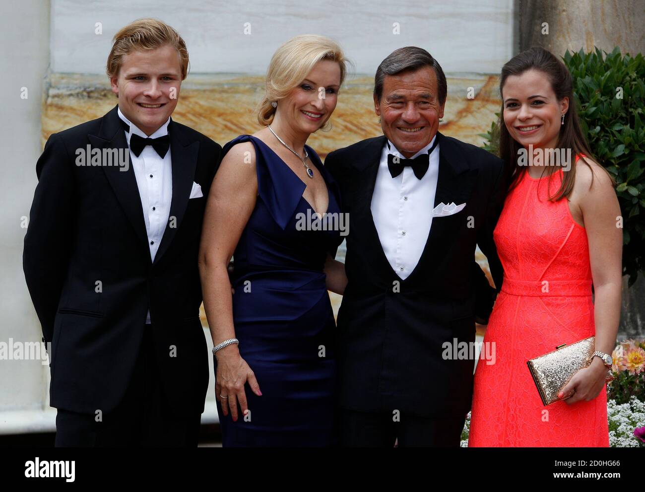 Trigema owner Wolfgang Grupp (2R) is flanked by his son Wolfgang (L-R),  wife Elisabeth and daughter Bonita as they arrive on the red carpet for the  opening of the Bayreuth Wagner opera