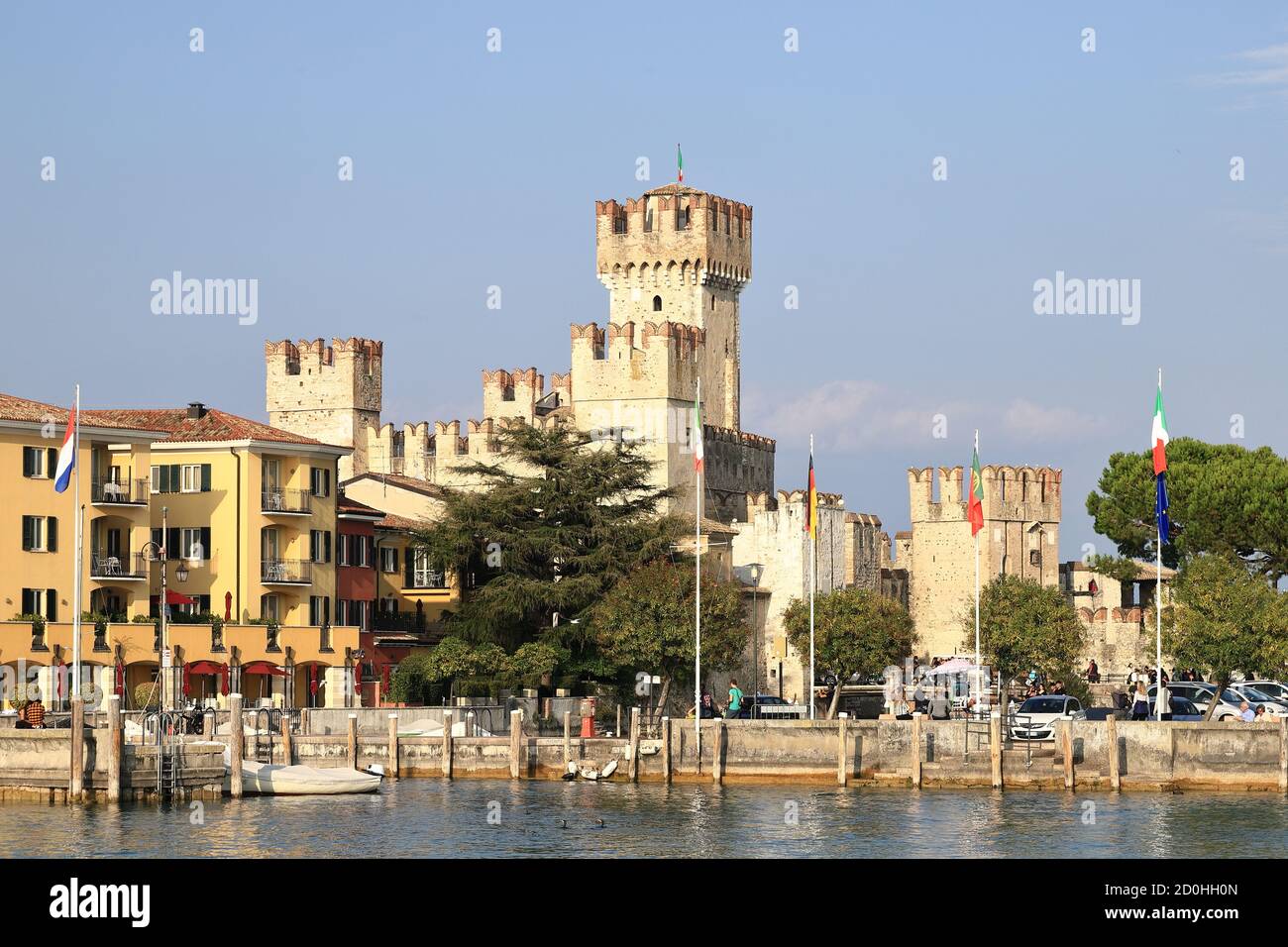 The view towards the resort town of Sirmione. Sirmione is on the edge of  Lake Garda in North East Italy and Scaligero Castle dominates the skyline  Stock Photo - Alamy