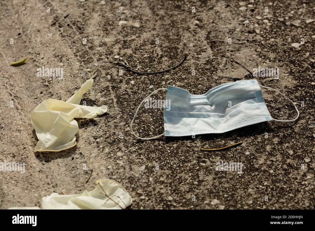 A mask and gloves were used for medical protection lost on the ground ...