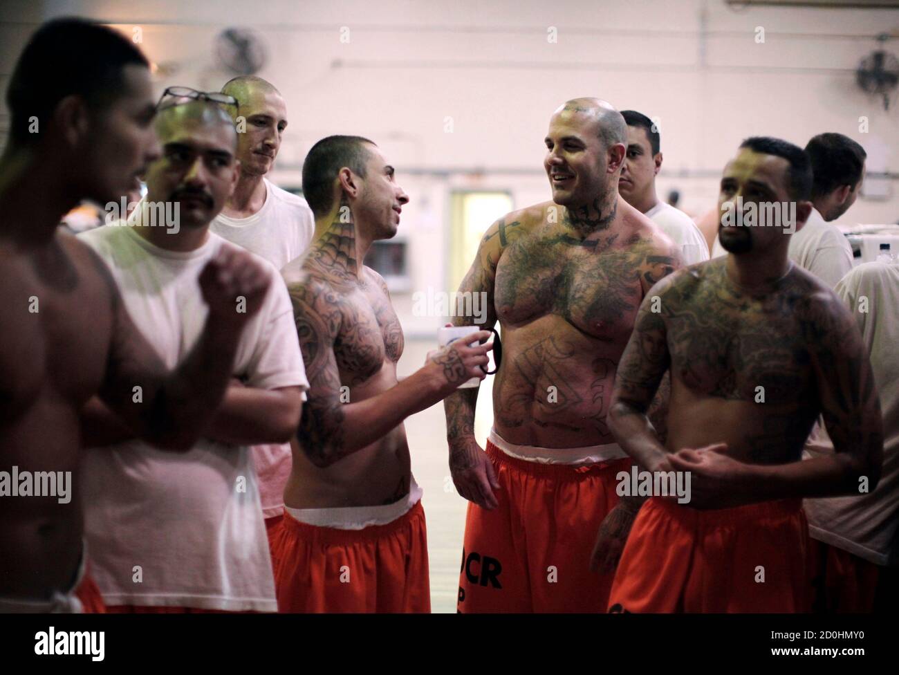 Inmates stand in a gymnasium where they are housed due to overcrowding at the California Institution for Men state prison in Chino, California, June 3, 2011. The Supreme Court has ordered California to release more than 30,000 inmates over the next two years or take other steps to ease overcrowding in its prisons to prevent 'needless suffering and death.' California's 33 adult prisons were designed to hold about 80,000 inmates and now have about 145,000. The U.S. has more than 2 million people in state and local prisons. It has long had the highest incarceration rate in the world. REUTERS/Lucy Stock Photo