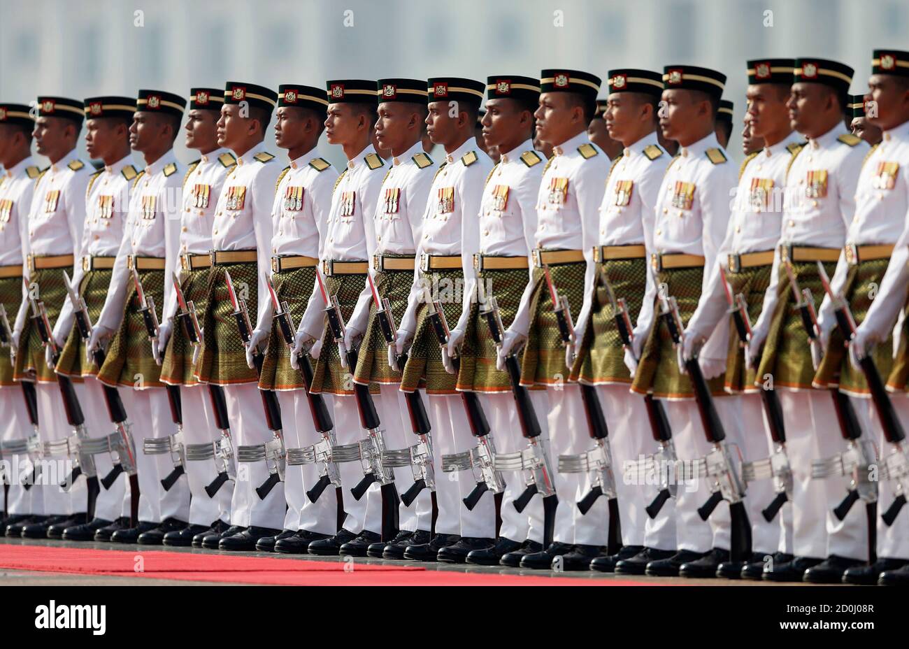 The Royal Malay Regiment honour guard stands to attention before 