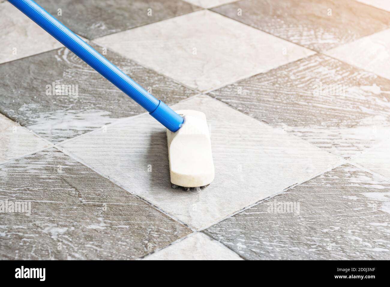 https://c8.alamy.com/comp/2D0J3NF/cleaning-the-tile-floor-with-floor-scrubber-brush-2D0J3NF.jpg
