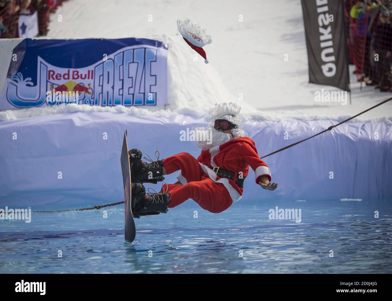 A snowboarder dressed as Santa Claus performs during the Red Bull Jump and  Freeze competition at ski resort Shimbulak outside Almaty March 22, 2015.  Participants wearing festive costumes perform tricks before getting