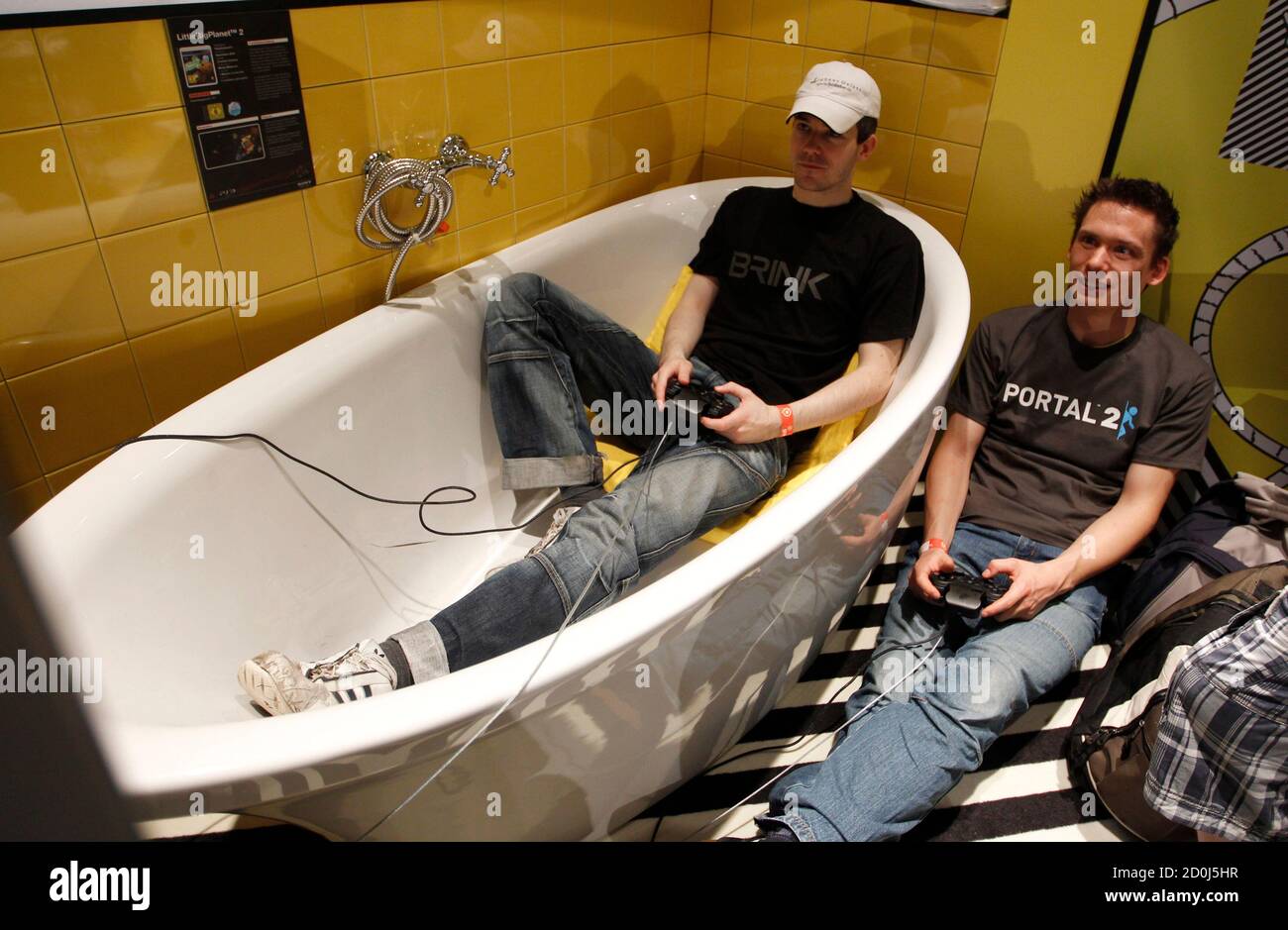Visitors Play With A Playstation At Their Exhibition Stand At The Gamescom 10 Fair In Cologne