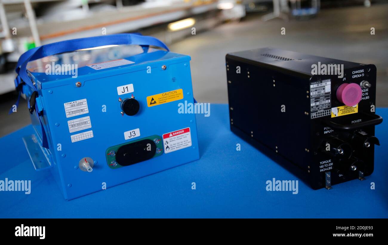Boeing's 787 renewal battery (L) and its battery charger are displayed at  All Nippon Airways's (ANA) maintenance center in Tokyo April 28, 2013. ANA,  the Japanese launch customer for Boeing Co's 787,