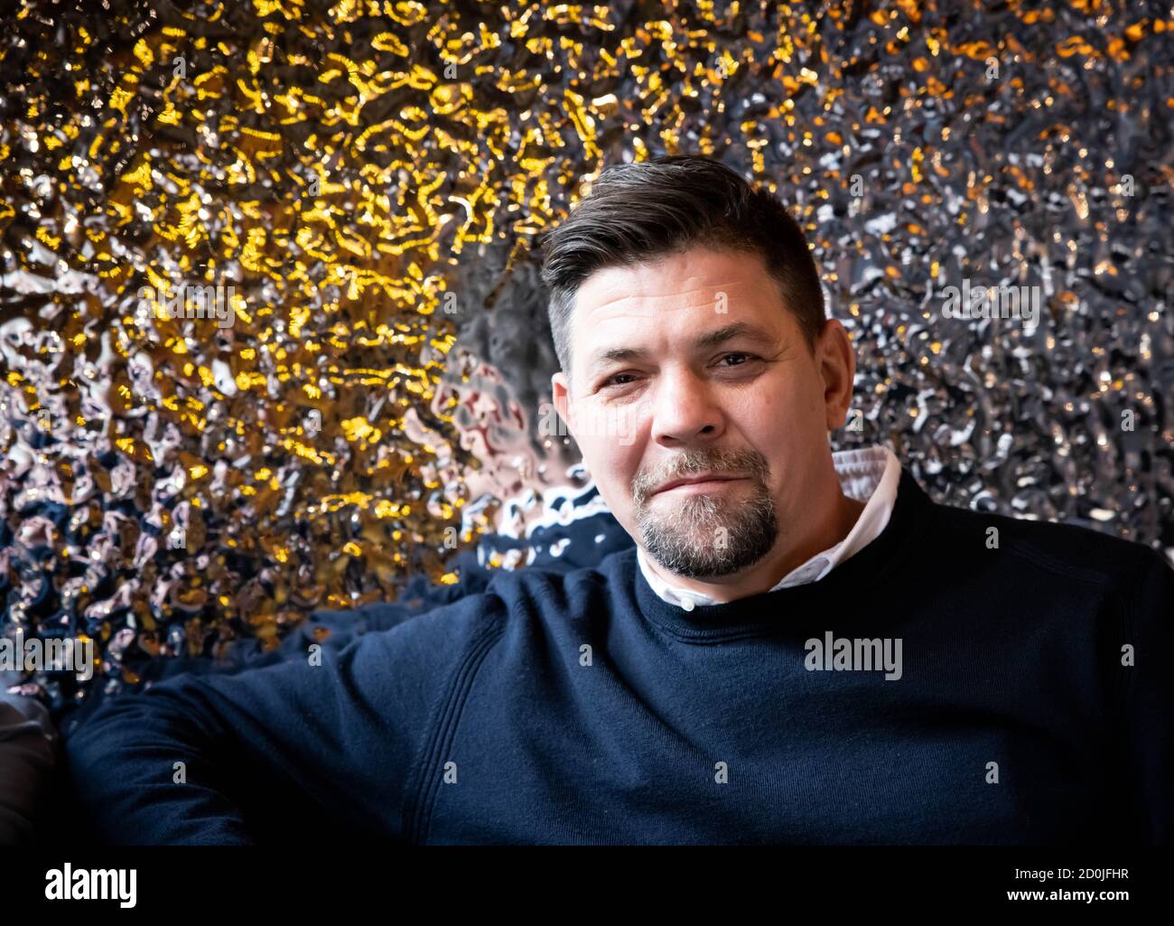 02 October 2020, Hamburg: TV chef Tim Mälzer sits at a table in the newly designed rooms of his restaurant 'Bullerei'. Mälzer and his business partner Rüther reopened on 03.10.2020 after a six-month compulsory break. Photo: Christian Charisius/dpa Stock Photo