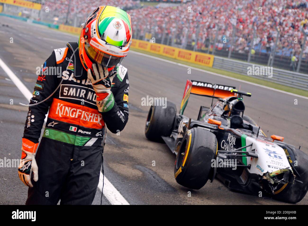 Force India Formula One driver Sergio Perez of Mexico reacts after a crash  during the Hungarian F1 Grand Prix at the Hungaroring circuit, near  Budapest July 27, 2014. REUTERS/Darko Bandic/Pool (HUNGARY -