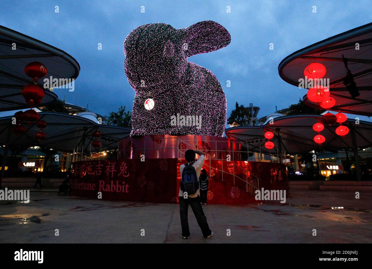 https www alamy com a tourist takes a picture of a four storey high topiary rabbit at resorts world sentosa in singapore january 30 2011 displayed as part of decorations to welcome the upcoming lunar new year the lunar new year begins on february 3 and marks the start of the year of the rabbit according to the chinese zodiac reutersalywin chew singapore tags society image379040106 html