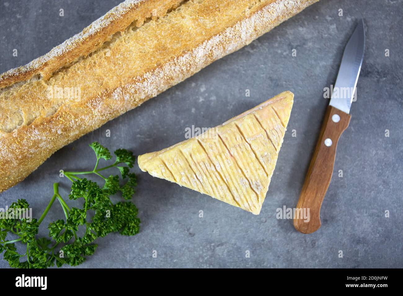 piece of maroilles and baguette Stock Photo