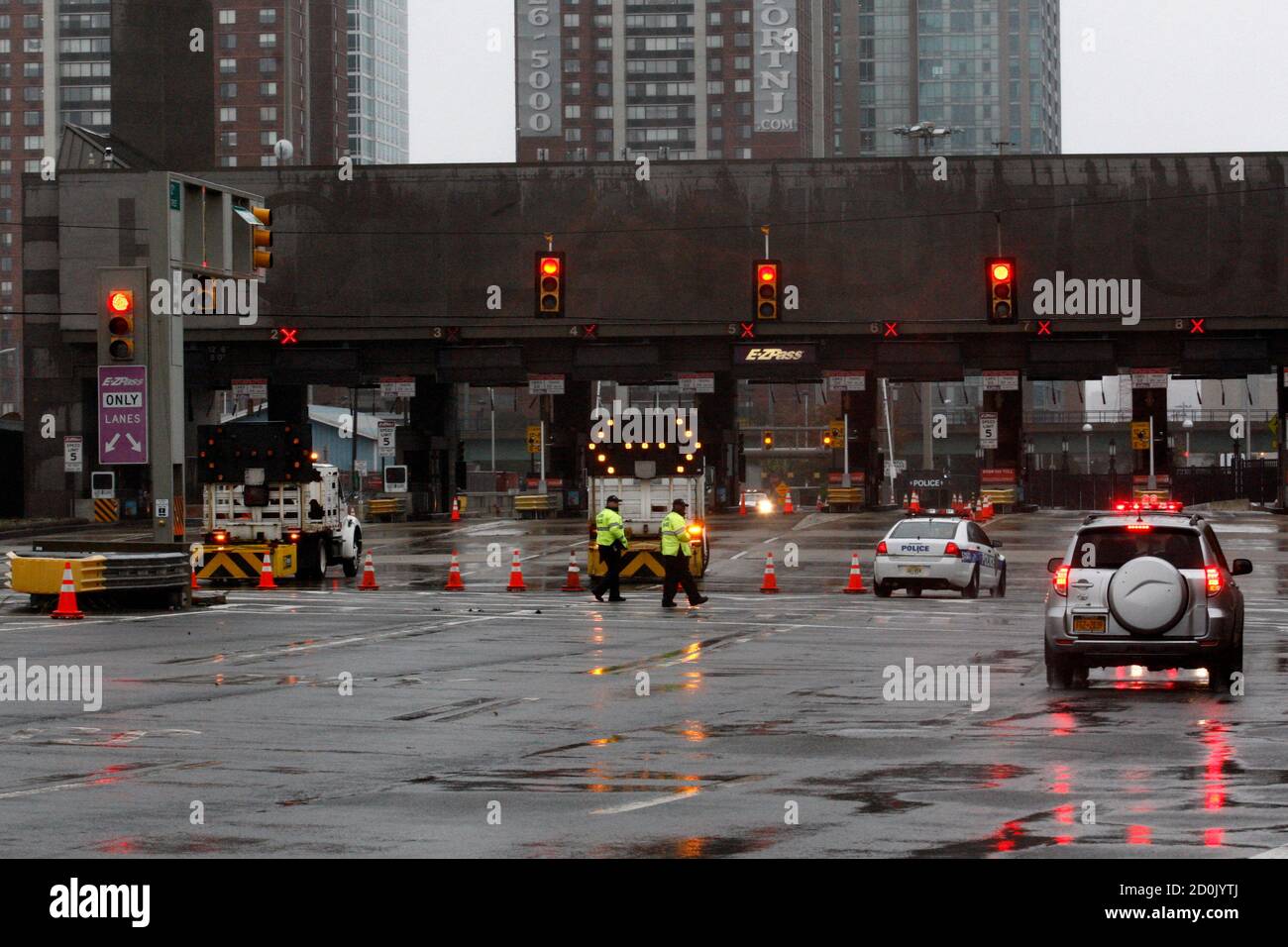 Police officers patrol the Holland Tunnel after being ...