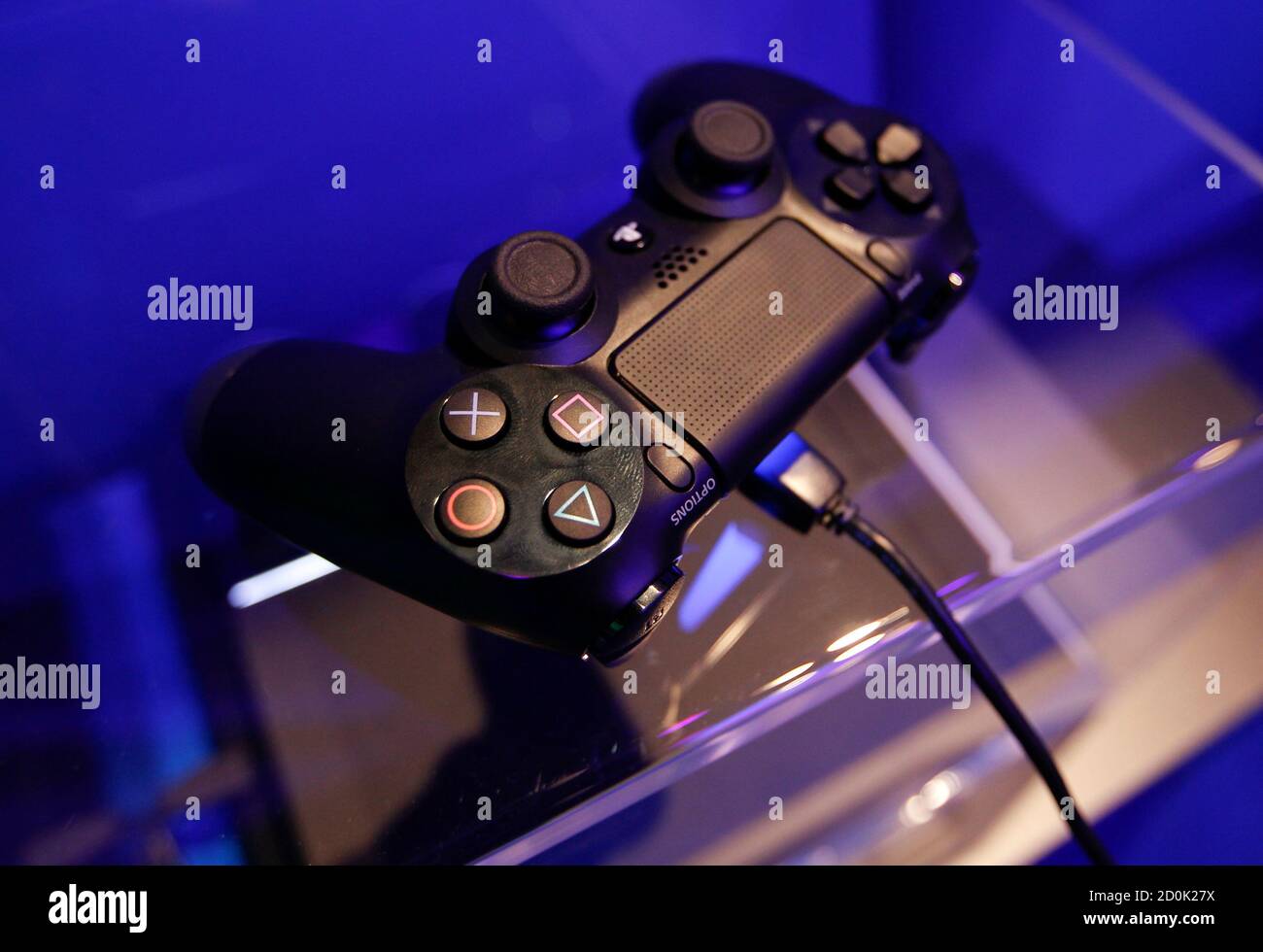 A Controller Of A Playstation 4 Is Pictured At The Sony Exhibition Stand During The Gamescom 13 Fair In Cologne August 21 13 Sony Has Had More Than One Million Preorders Worldwide