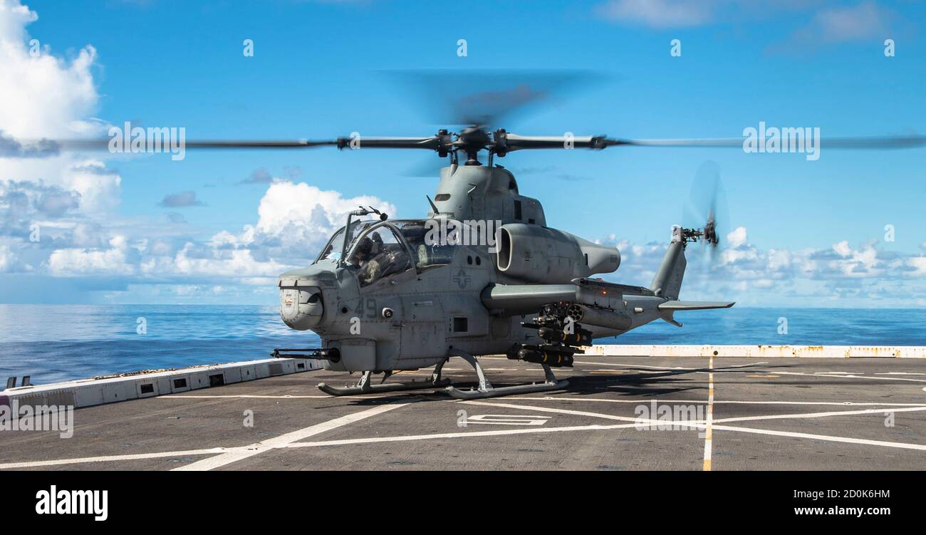 PHILIPPINE SEA (Sept. 26, 2020) An AH-1Z Viper attack helicopter with Marine Medium Tiltrotor Squadron 262 (Reinforced), 31st Marine Expeditionary Unit (MEU), prepares to take off from USS New Orleans (LPD 18). New Orleans, part of Expeditionary Strike Group Seven (ESG 7), along with the 31st Marine Expeditionary Unit, is operating in the U.S. 7th Fleet area of responsibility to enhance interoperability with allies and partners and serve as a ready response force to defend peace and stability in the Indo-Pacific region. (U.S. Marine Corps photo by Lance Cpl. Joshua Brittenham) Stock Photo