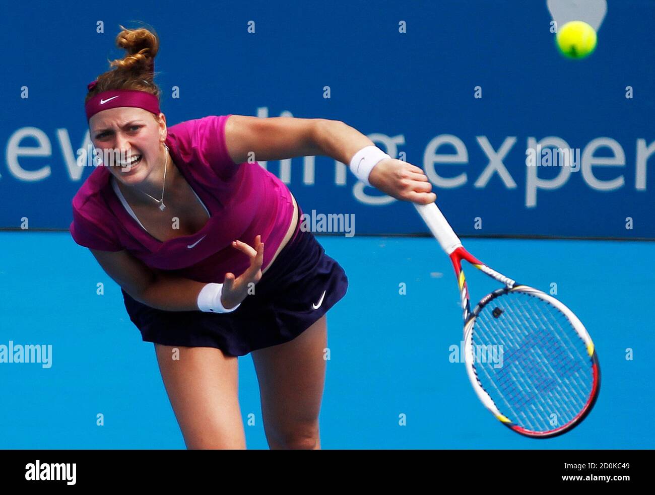 Petra Kvitova of Czech Republic serves to Alexandra Dulgheru of Romania  during their match at the Sydney International tennis tournament January  10, 2012. REUTERS/Daniel Munoz (AUSTRALIA - Tags: SPORT TENNIS Stock Photo  - Alamy