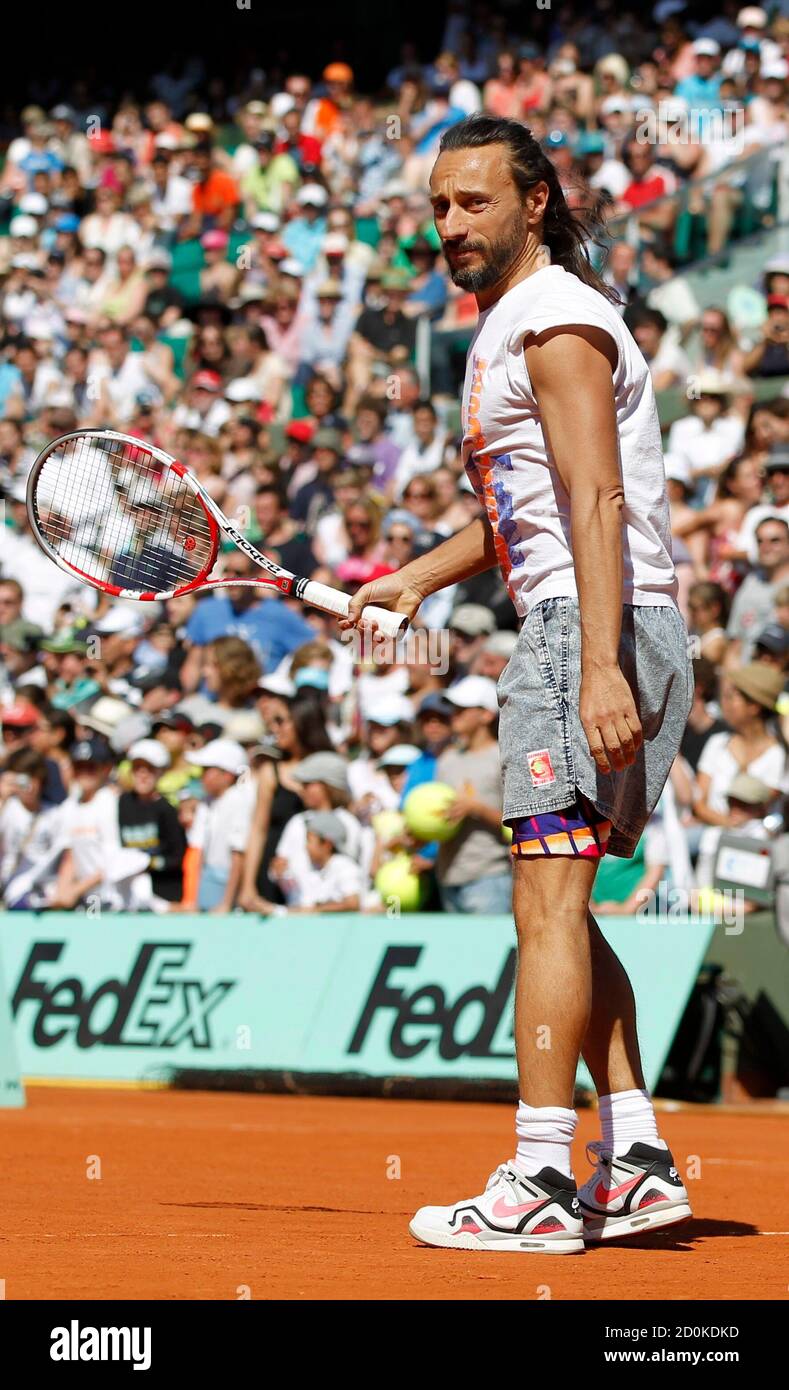 DJ Bob Sinclar takes part in an exhibition match held a day before the  start of the French Open tennis tournament at the Roland Garros stadium in  Paris May 26, 2012. REUTERS/Francois