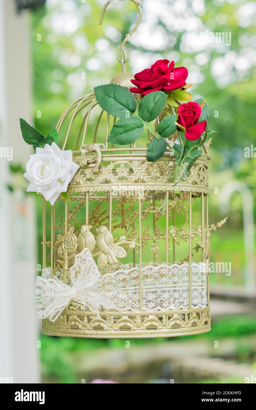 Decorative Bird Cage Outdoors Wedding Decor With Red And White Roses Stock Photo Alamy