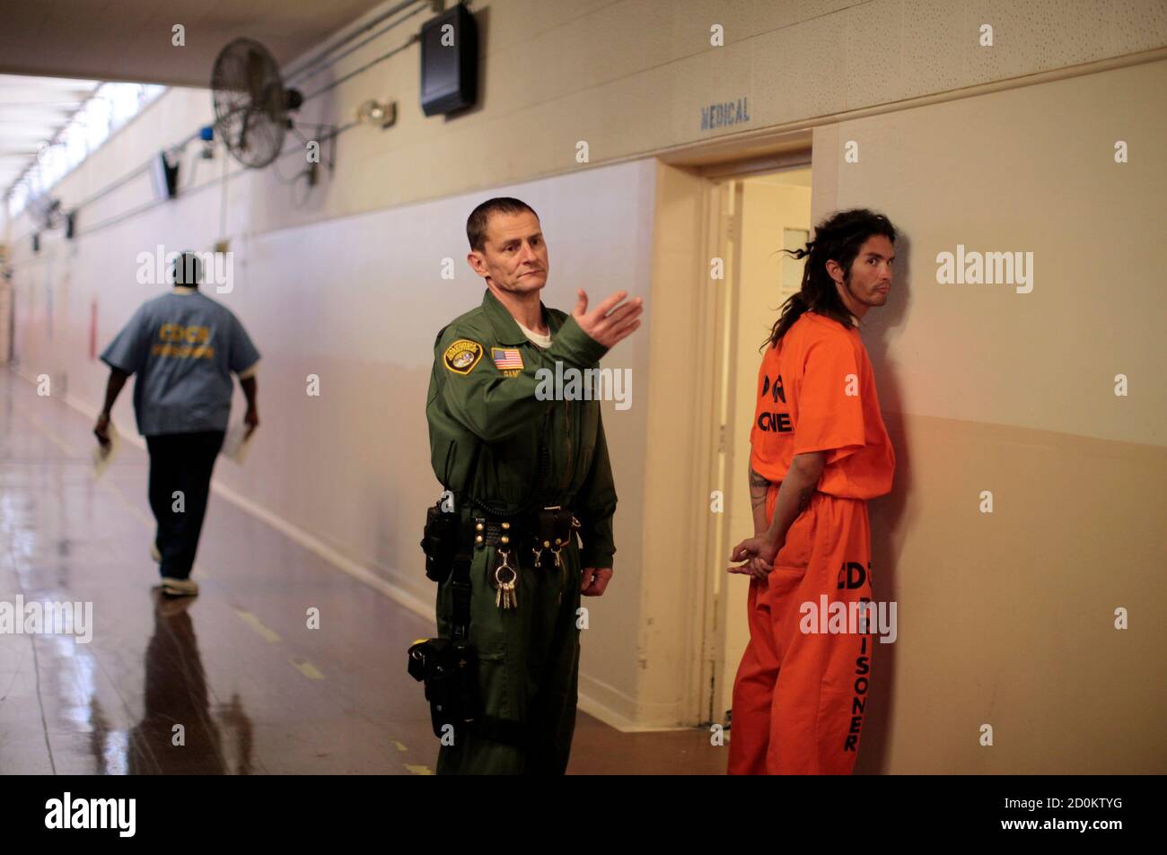 An inmate is led by a prison guard at the California Institution for Men state prison in Chino, California, June 3, 2011. The Supreme Court has ordered California to release more than 30,000 inmates over the next two years or take other steps to ease overcrowding in its prisons to prevent "needless suffering and death." California's 33 adult prisons were designed to hold about 80,000 inmates and now have about 145,000. The United States has more than 2 million people in state and local prisons. It has long had the highest incarceration rate in the world. REUTERS/Lucy Nicholson (UNITED STATES - Stock Photo