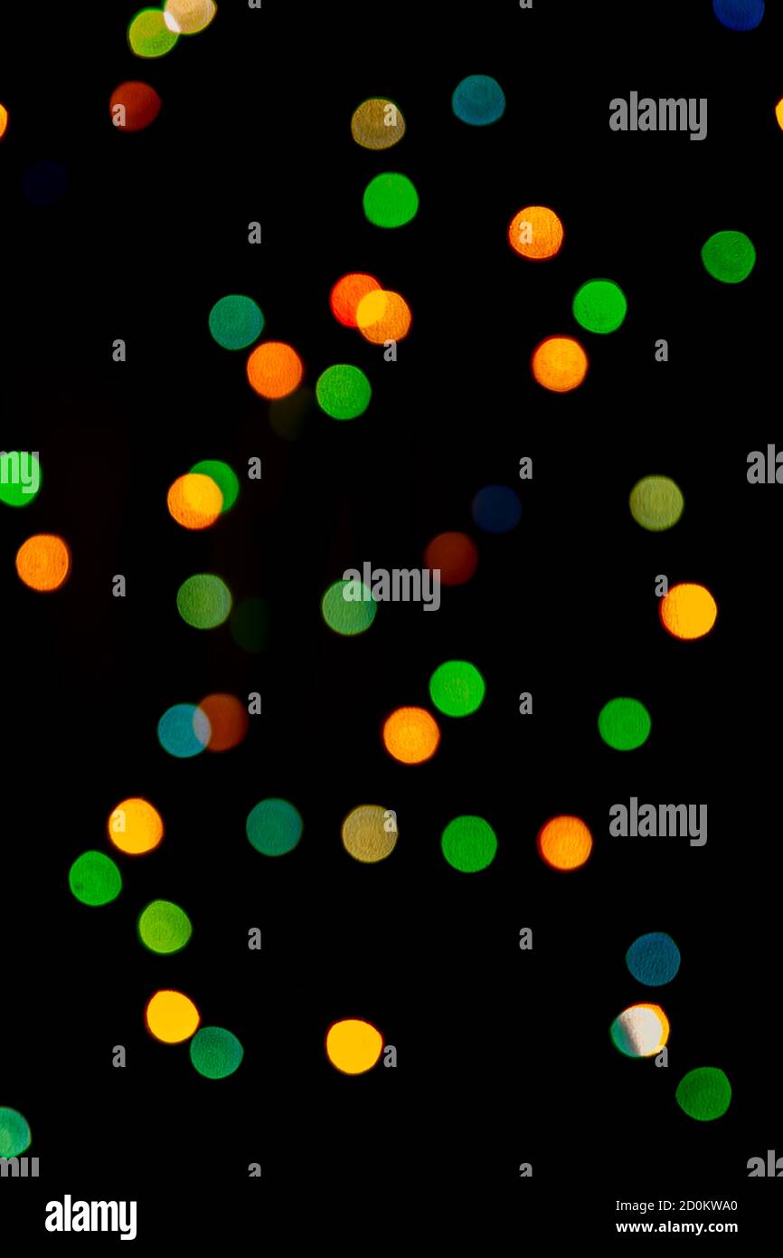 Multicolored abstract bokeh on black background Stock Photo