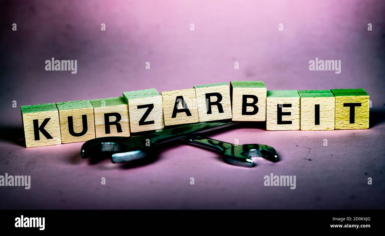 wooden-blocks-with-german-word-for-short-time-work-kurzarbeit-above