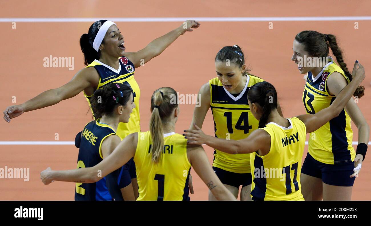 Players from Turkey's Fenerbahce celebrate a point against Kenya's Kenya  Prisons during their match in the FIVB Women's Volleyball Club World  Championships in Doha, October 17, 2012. REUTERS/Fadi Al-Assaad (QATAR -  Tags: