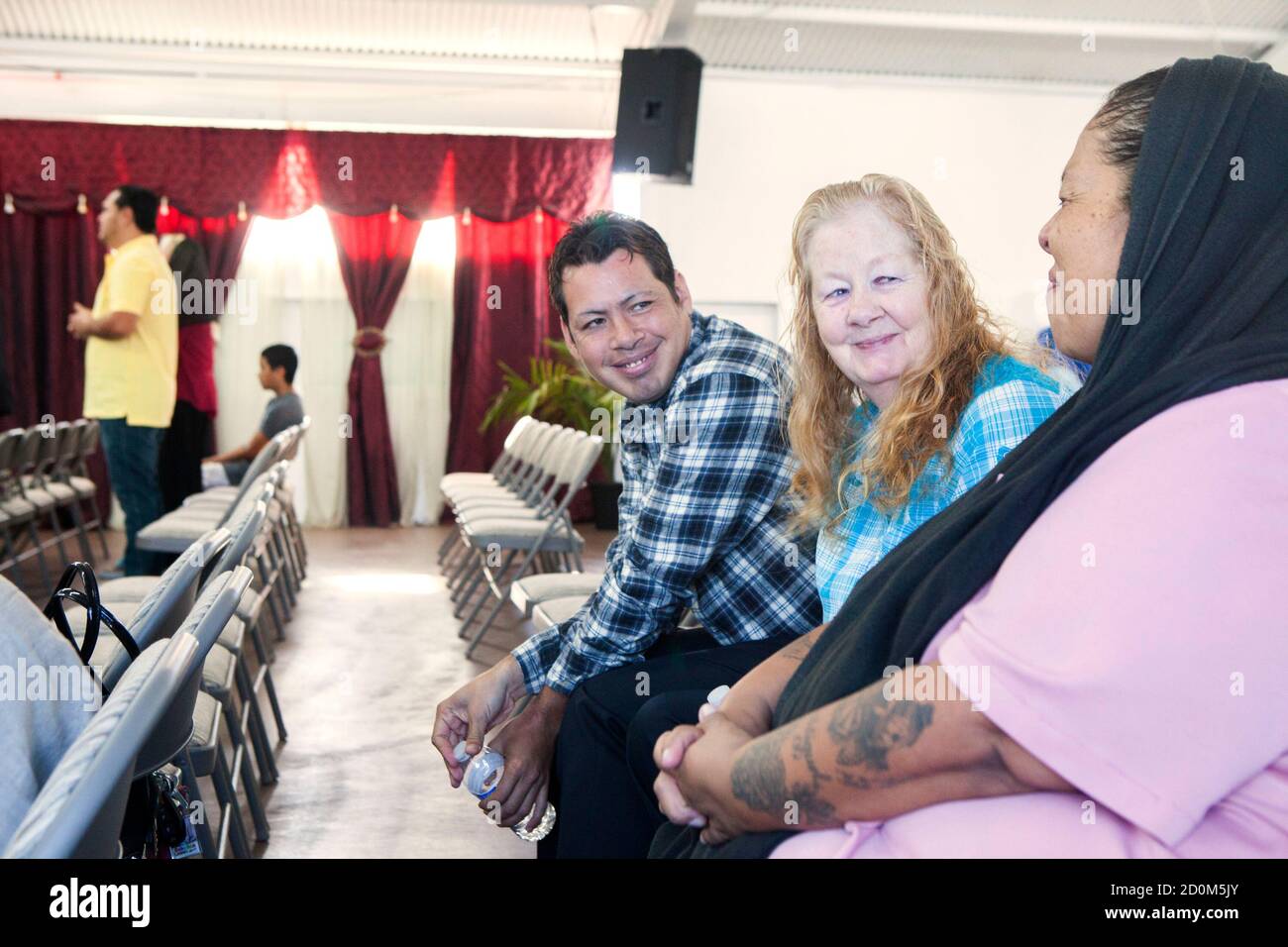 David Amaya and his mother Kathy Amaya talk to each other through  translator Behriz Castro at Iglesia de Cristo Ministerios Llamada Final in  San Diego, California November 24, 2013. Amaya was abducted