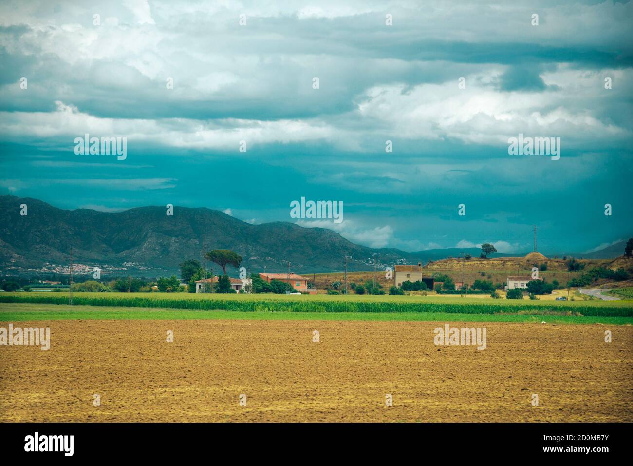 Landscape with field and houses in Spain Stock Photo - Alamy