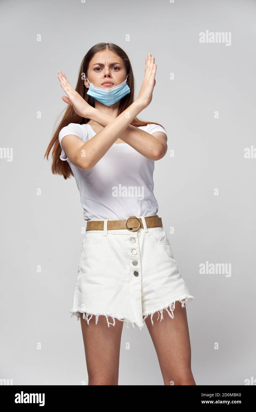 woman in the medical mask crossed her arms in front of her with Stock ...