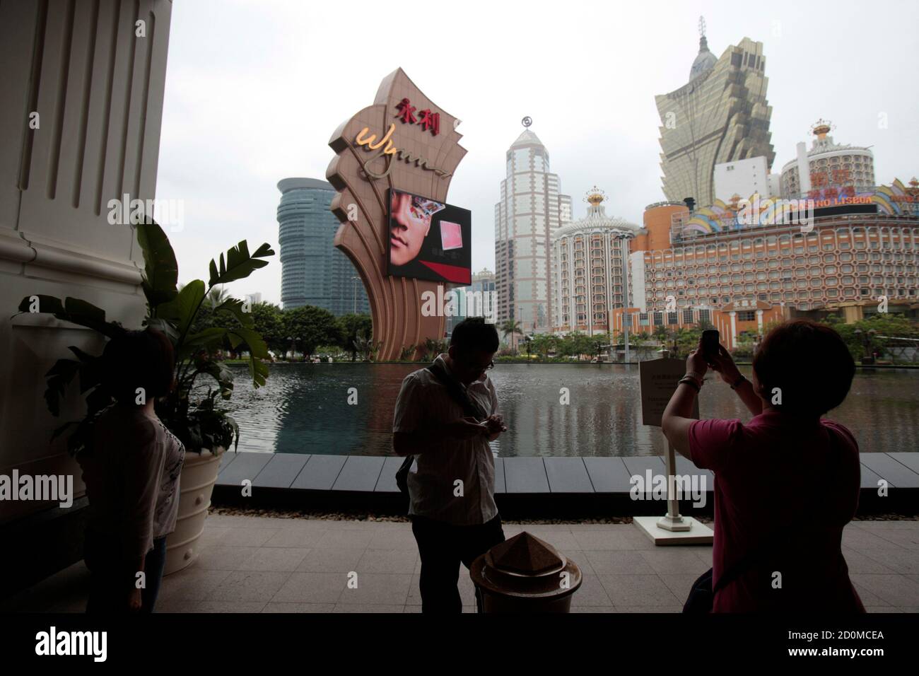 Visitors From Mainland China Take Pictures Outside The Wynn Hotel In Macau May 17 2011 U S