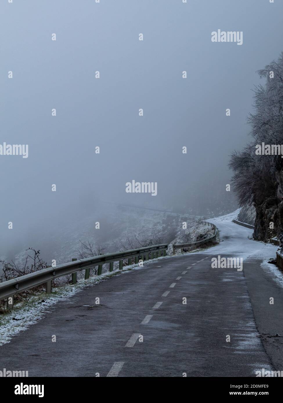Snowy road with no vision due to fog. Stock Photo