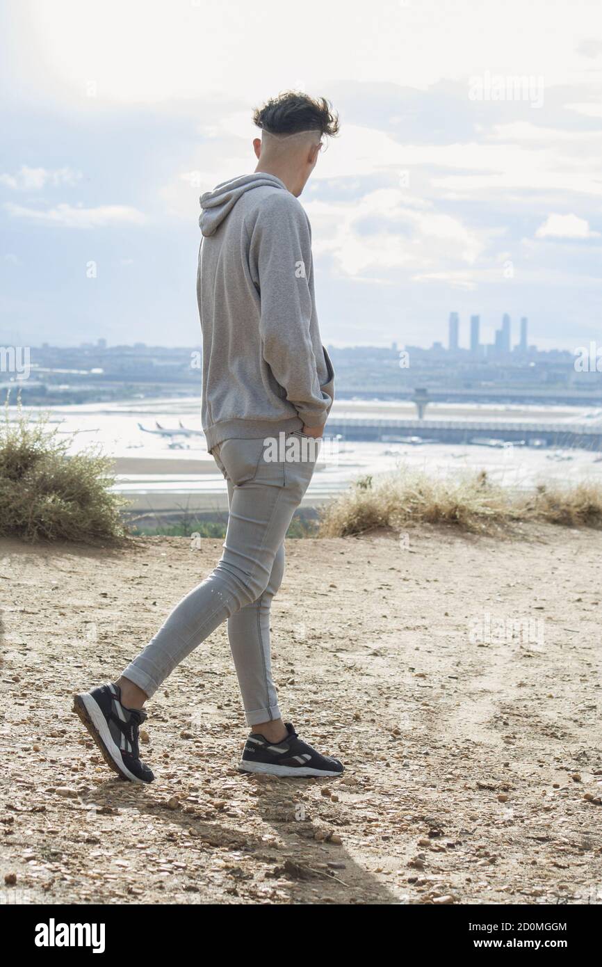 Cool young man walking city hi-res stock photography and images - Alamy