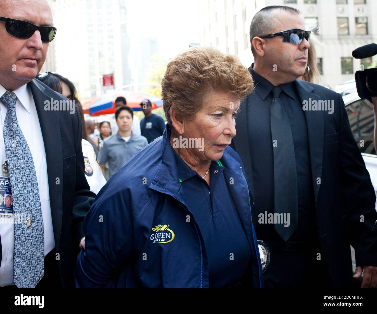 Lois Ann Goodman, 70, is led away from the Manhattan Criminal Court after  being extradited to California in the custody of Los Angeles Police  Department detectives in New York, August 23, 2012.