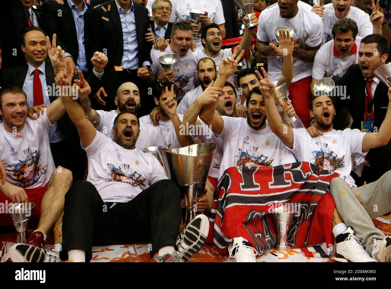 Olympiakos' players and team members pose with the trophy after winning the  Euroleague Basketball Final Four final game against Real Madrid at the O2  Arena in London May 12, 2013. REUTERS/Suzanne Plunkett (