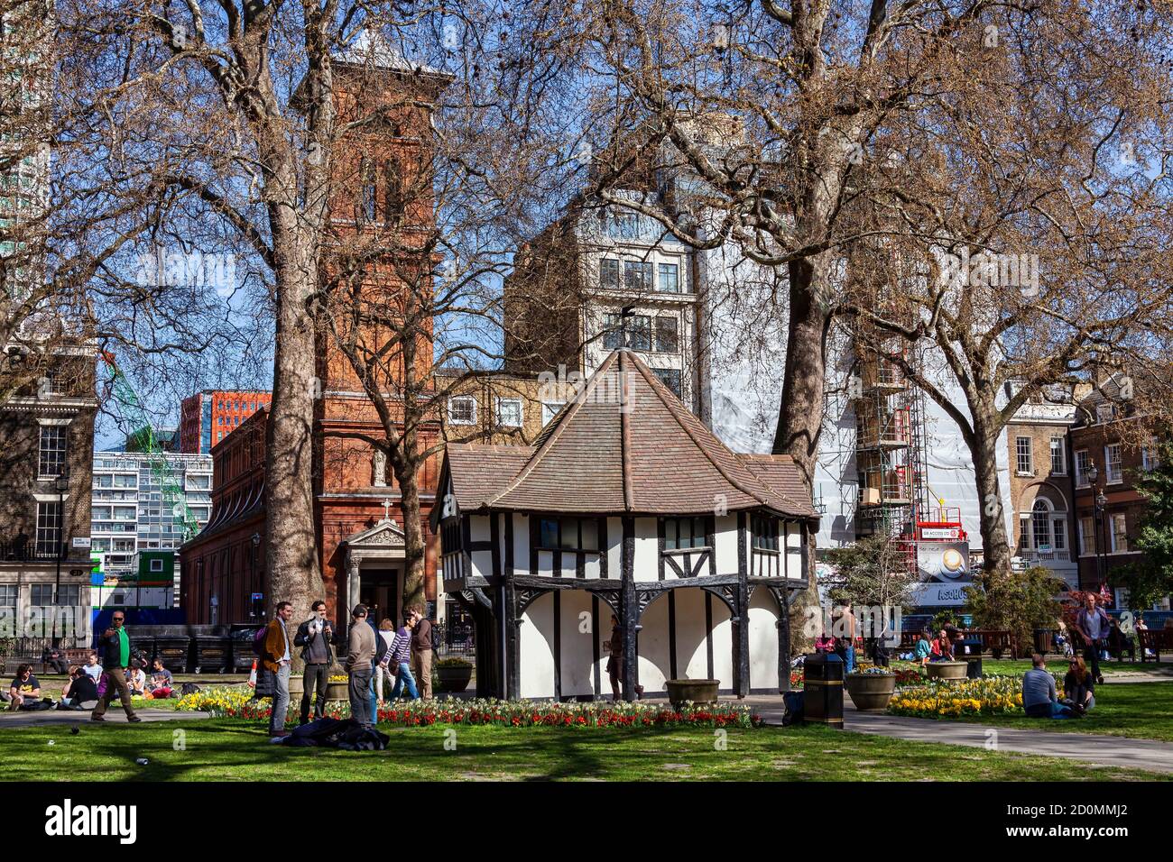London, UK, April 1, 2012 : Soho Square public park market cross an old fashioned mock architecture building which is a popular open space travel dest Stock Photo
