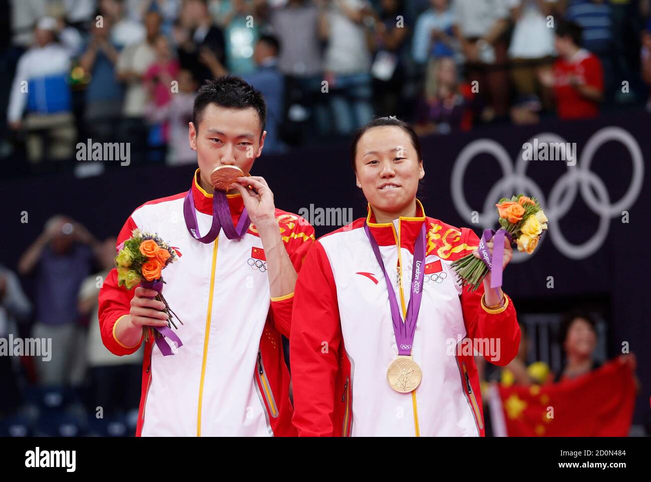 Gold medalists China's Zhang Nan (L) and Zhao Yunlei pose for media during  the victory ceremony for the badminton mixed doubles event at the London  2012 Olympic Games at the Wembley Arena